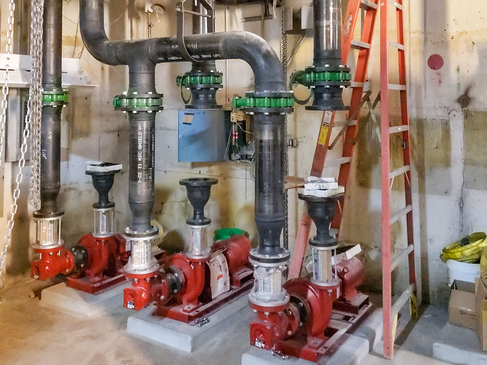 New Hot Water Pumps and concrete Pads in LE Boiler Room
