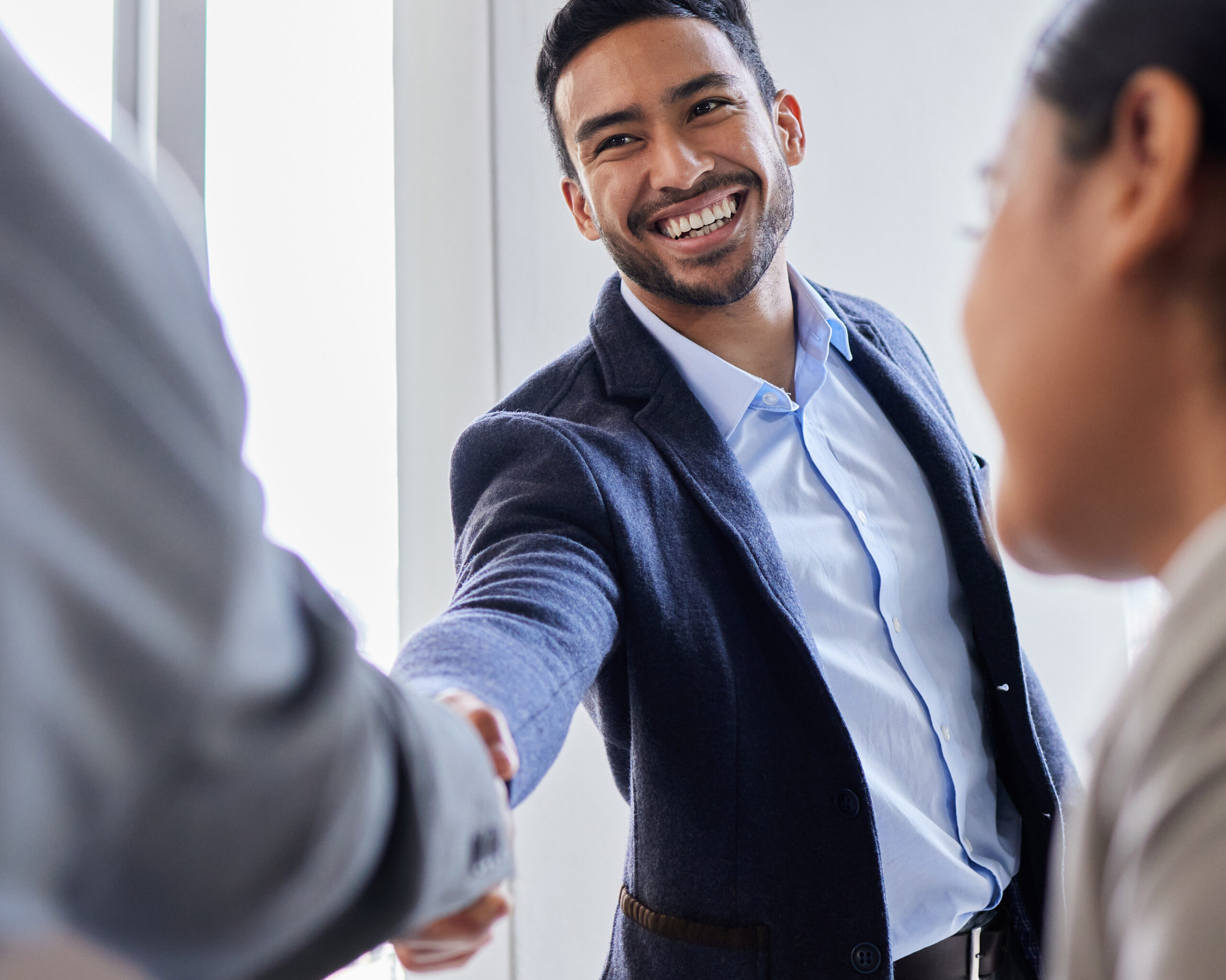 Meeting, smile and handshake with business people in office, b2b deal or agreement for startup opportunity. Hand shake, partnership and welcome, happy businessman shaking hands for onboarding support.